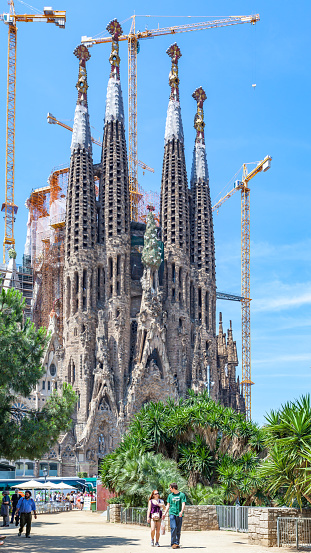 Barcelona, Spain - June 14, 2011: Tourists by The La Sagrada Familia cathedral in Barcelona