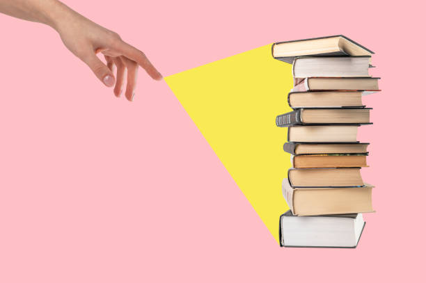 istock Light ray coming from woman hand to books stack on pink background. Education, getting knowledge, wisdom concept. Collage 1396116921
