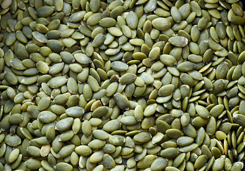 Closuep of pepitas aka pumpkin seeds.