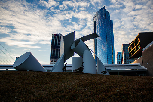Photograph of sculptures at the Milwaukee Art Museum in the Milwaukee Skyline.