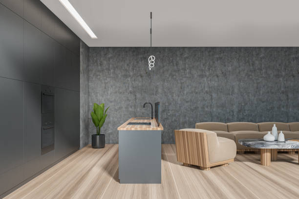 istock Modern design dining living room and kitchen interior with empty island table, small coffee table, big couch, hardwood flooring. Cooking area concept. 3d rendering 1396122380