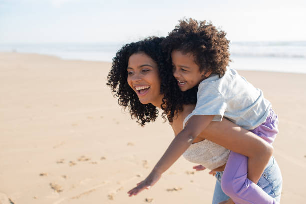 istock Content mother and daughter spending time on beach 1396123233