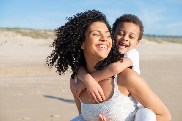 istock Contented mother and son spending time on beach 1396123239