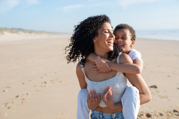 istock Joyful mother and son spending time on beach 1396123245