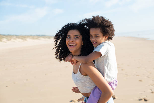 istock Loving mother and daughter spending time on beach 1396123257