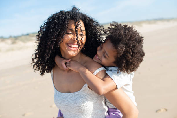 istock Tender mother and daughter spending time on beach 1396123305
