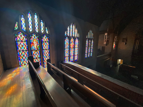Sunlight Pouring Through a Church's Stained Glass Windows