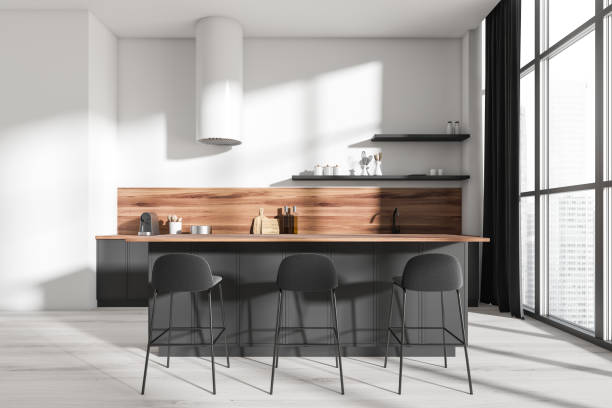 istock Bright kitchen room interior with eating island, barstools, panoramic window 1396123852