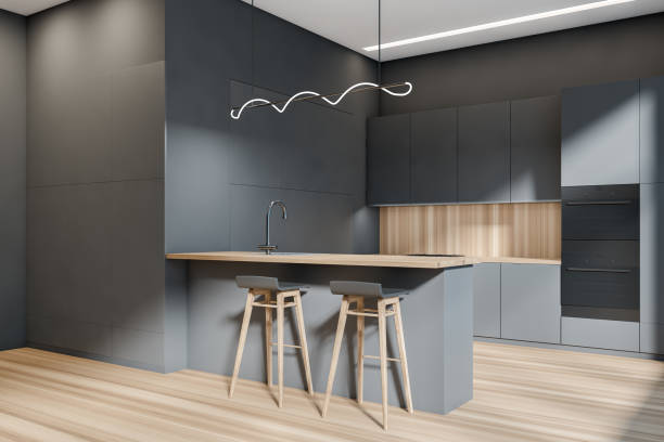 istock Corner view on dark kitchen room interior with double oven 1396125091