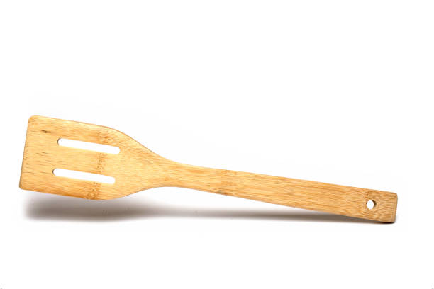 istock cooking spoon pan turner slices white background 1396126702