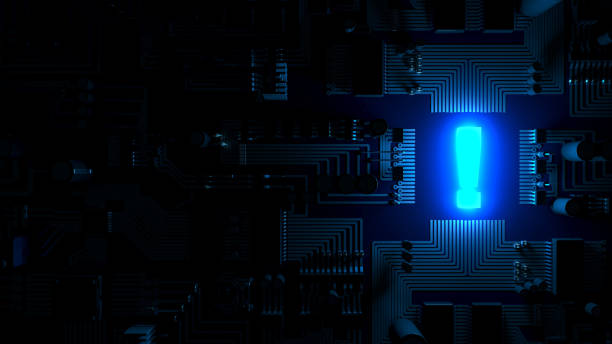 Top View of a Circuit Board in the Dark with a Luminous Exclamation Mark stock photo