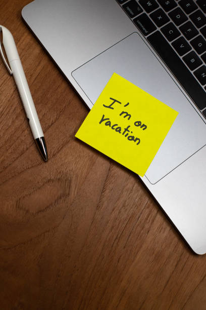 istock a message is written on a yellow sticker paper and placed on a computer keyboard: I'm on vacation 1396130247