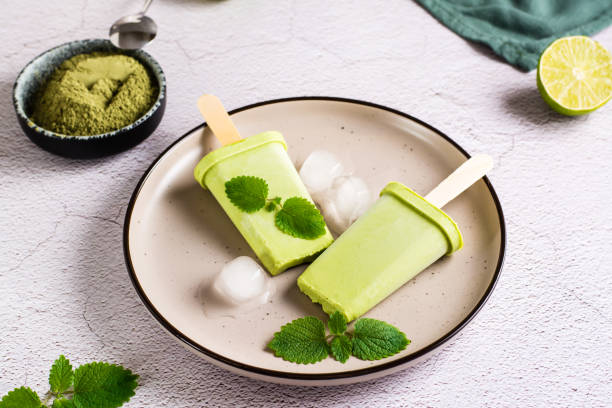 istock Vegetarian popsicle made from matcha tea, coconut milk and mint on a plate. Close-up 1396133251