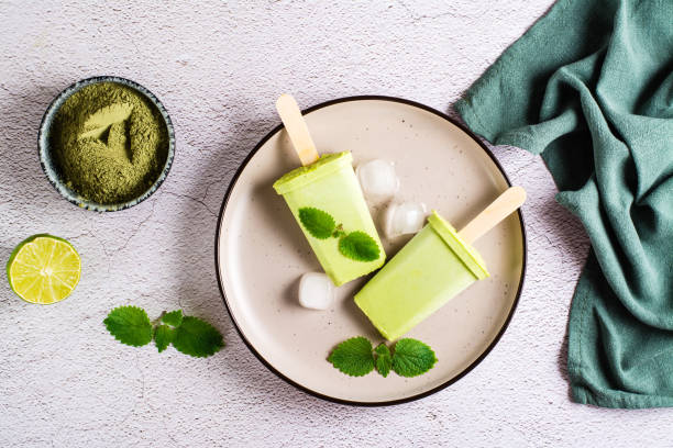 istock Vegetarian popsicle made from matcha tea, coconut milk and mint on a plate. Top view. 1396133256