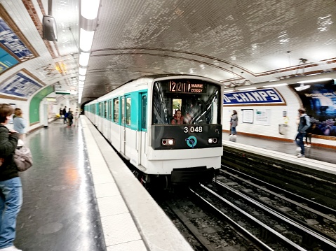 The Notre-Dame-des-Champs (Paris) is a station on line 12 of the Paris Métro in the 6th arrondissement. The image shows the metro platforms with an approaching metro train.