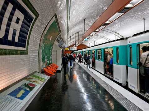 Pasteur (Paris Métro) is a station on line 12 of the Paris Métro in the 15th arrondissement. The image shows a metro train of the Line 12 just before departing..