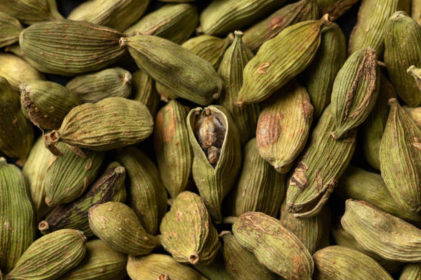 istock Green cardamom pods, spice, close up, macro. background texture. 1396133590