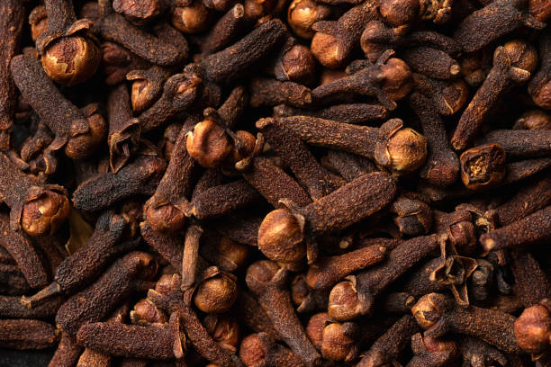 istock Drieyd Aromatic cloves, spice. Macro photo, background. 1396133594