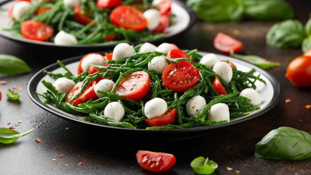 Fresh Samphire salad with cherry tomatoes and mozzarella. Healthy food. Fresh Samphire salad with cherry tomatoes and mozzarella. Healthy food salicornia europaea stock pictures, royalty-free photos & images