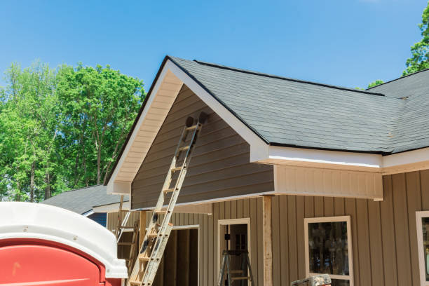 istock Roof shingles in top the on new home under construction site 1396136285