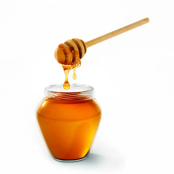 Fresh honey dripping from wooden honey dipper with honey jar - 3D illustration