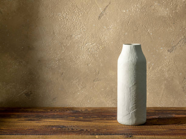 istock white vase on wooden table 1396139433