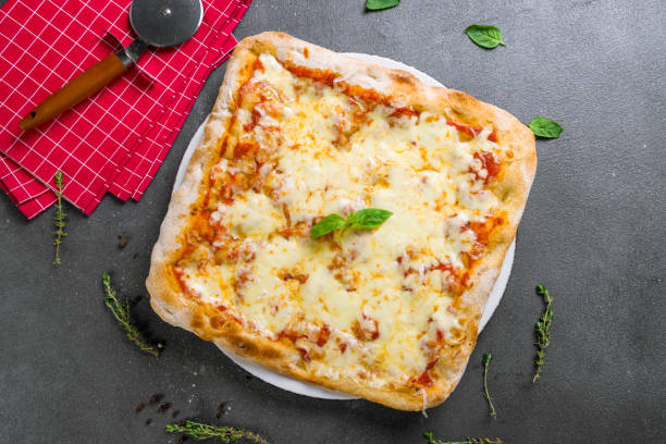 istock margarita pizza at the Rome dough with basil,pinsa, on grey table top view 1396145788