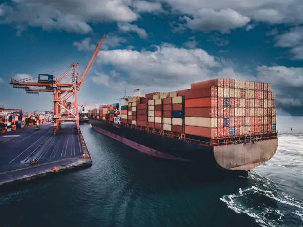 Photo of Aerial view of Container freight ship in transit.