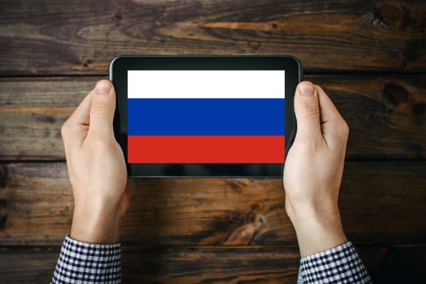 istock Russian flag on tablet screen. Technology search background. Searching information about enemy at war. Stop the war background. 1396148788