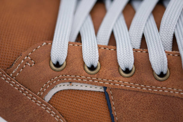 istock new shoelaces in brown sneakers 1396158992