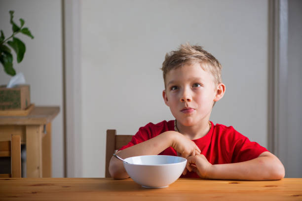 Cute boy peeking over kitchen countertop