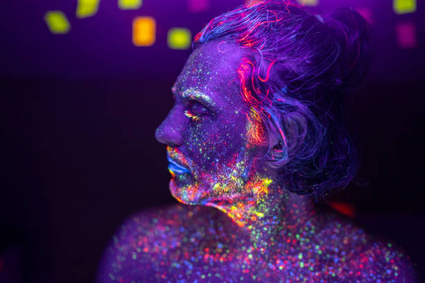 Portrait of a man's face under UV lights