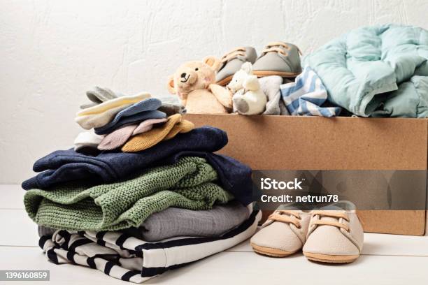 Baby And Child Clothes Toys In Box Second Hand Apparel Idea Circular Fashion Donation Charity Concept Stock Photo - Download Image Now