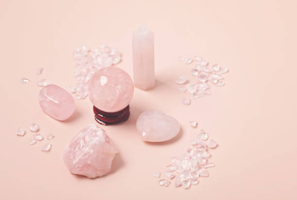Healing reiki chakra crystals therapy. Alternative rituals with pink quartz for wellbeing, meditation, relaxation, mental health, spiritual practices. Energetical power concept