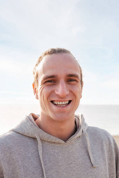 istock young man smiling happy and looking at camera 1396161402