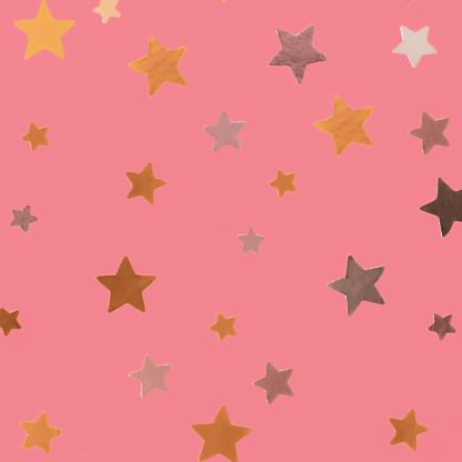 Gold and silver stars on pink background. Abstract decoration for party, birthday celebrate, event, festive. Festival stars decor.