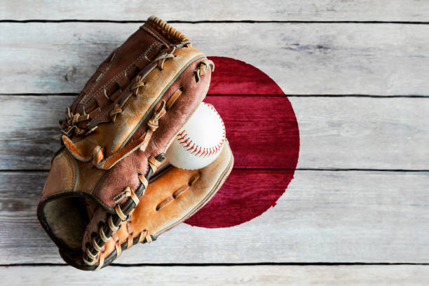 istock Leather Baseball Glove With Ball on Painted Japanese Flag 1396162284