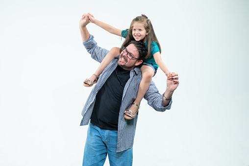 Portrait of father and daughter, studio photo