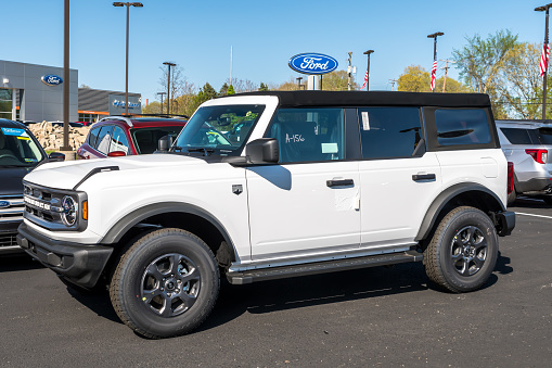 Harmar Township, Pennsylvania, USA May 8, 2022 A new white Ford Bronco SUV for sale at a dealership on a sunny spring day