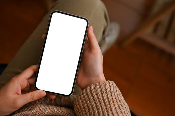 istock Top view, A mockup screen of a modern cellphone touchscreen in a women's hands. 1396173829