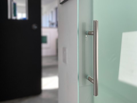 Modern door handle on glass door