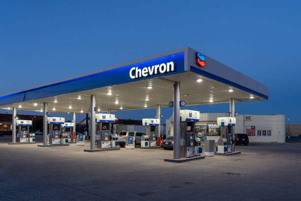 A Chevron gas station at night is shown in Dallas, Texas, USA. stock photo
