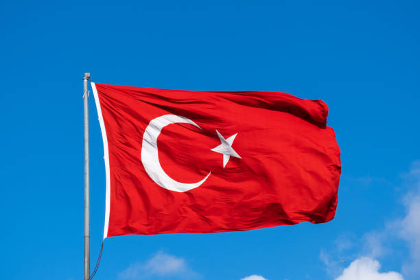 istock Turkish flag waving in the blue sky, flagpole, 1396178190