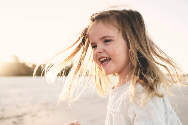 istock Little girl laughing 1396178197
