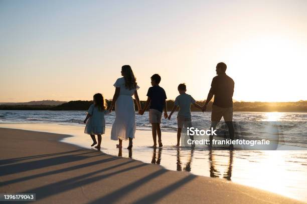 Family Of Five Walking The Beach Stock Photo - Download Image Now - Family, Beach, Walking