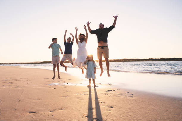 istock Family Jumping at Sunset 1396179048