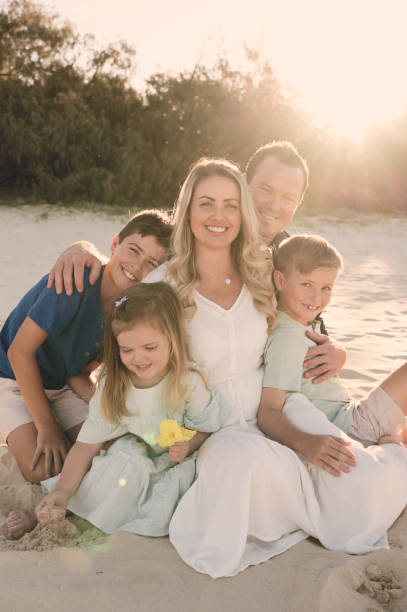 istock Beautiful family embracing at sunset 1396179731