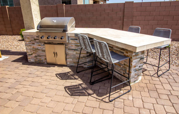 istock Outside BBQ Station With Four Bar Stools 1396181418