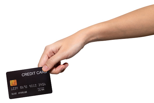Close up woman hand hold black credit card isolated on white background with clipping path.