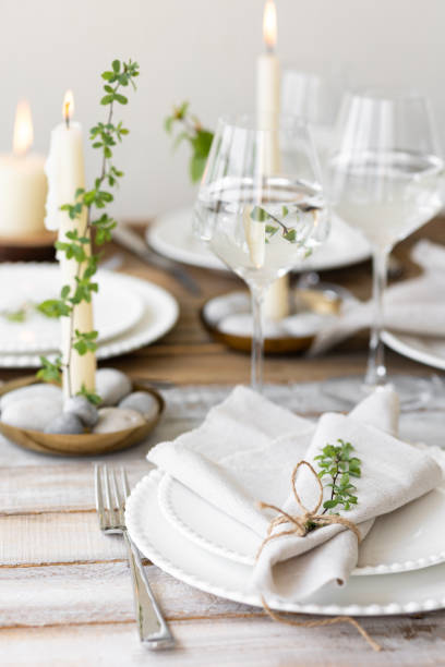 istock Rustic zero waste wedding decor with natural elements. Wooden table, candles, linen napkins, branches with green leaves. Eco-friendly decoration for the special dinner. Romantic and cozy place 1396186267